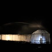 The dome-tunnel by night with a sprinkler being tested.